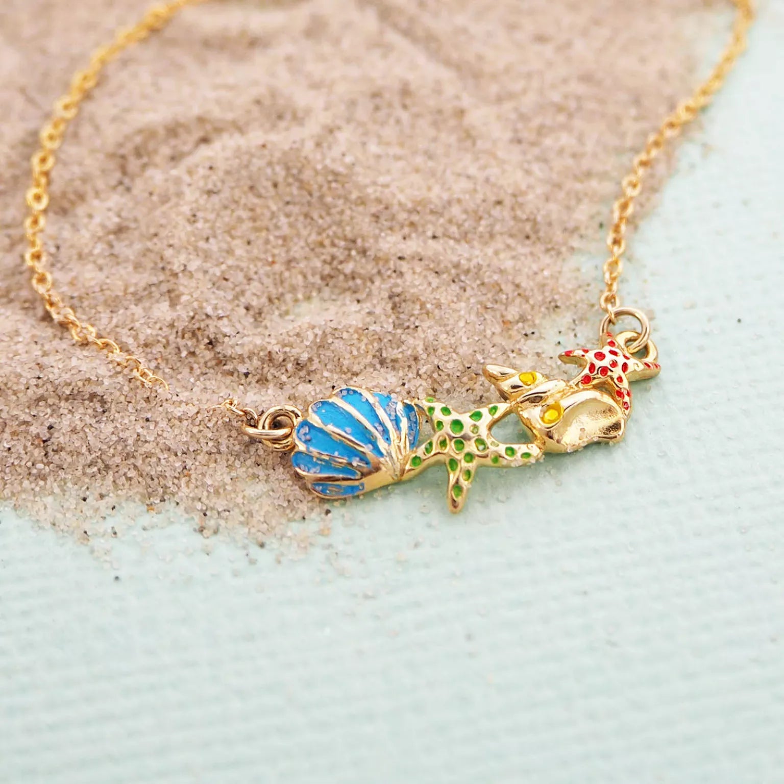 Beach shell necklace in 9kt gold
